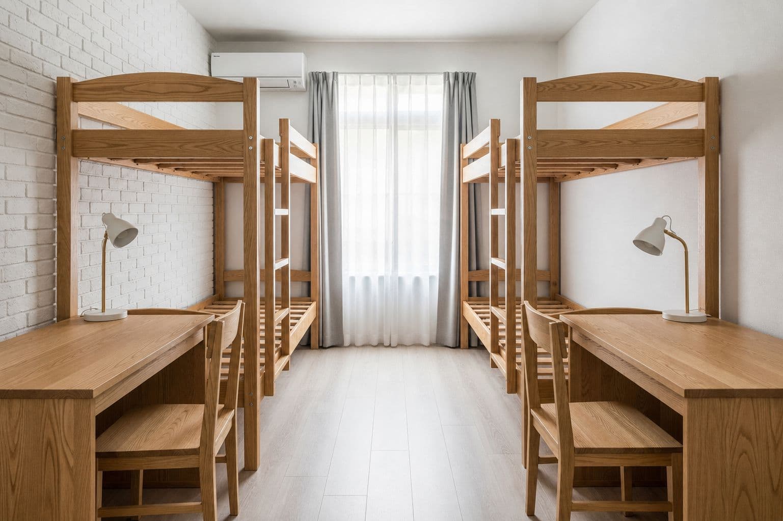 the bare chicago double before styling — two empty wooden loft beds, desks, and blank walls